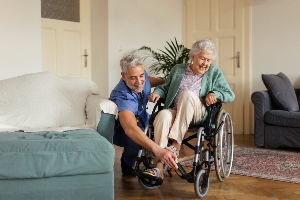 Caregiver doing regular check-up of senior woman in her home.